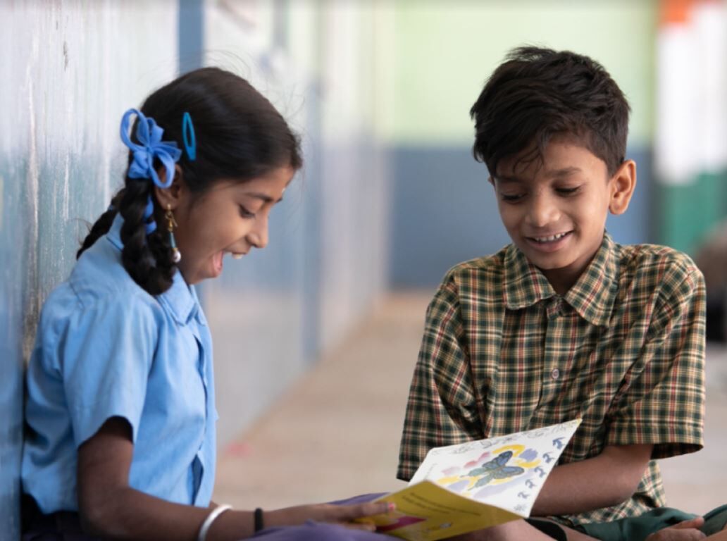 indian kid reading a book